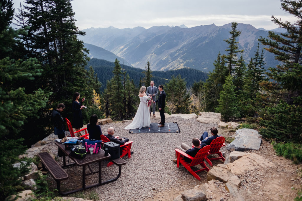 A vail mountain elopement ceremony as a couple exchanges their vows.
